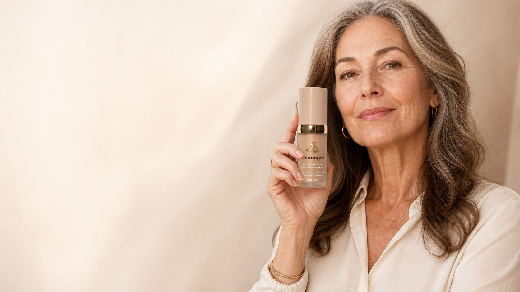 Loumeyra mature woman holding the 4-in-1 Adaptive Foundation